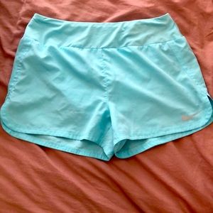 Blue Nike running shorts